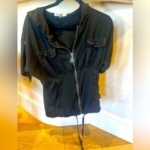 Lightweight zip up with hood and adjustable tie bottom